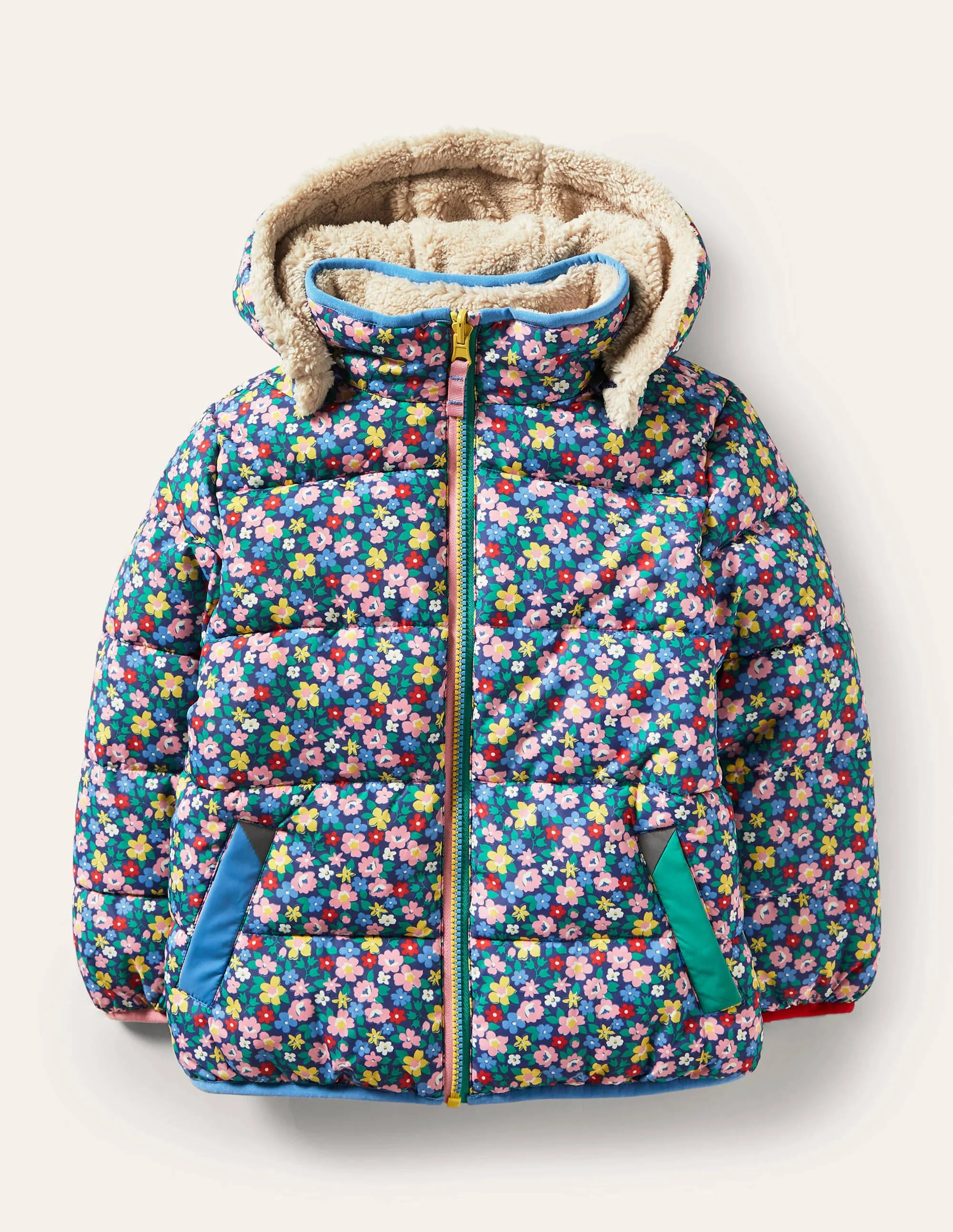 Wendbare gemusterte Steppjacke-Segelblau, Frühlingsblumen